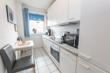 Zeitlos attraktiv & solide vermietet: 2-Zimmer-Erdgeschosswohnung mit Südterrasse in gepflegter Lage - Küche