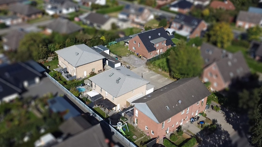 Luftansicht - Einmalige Investmentgelegenheit: Attraktiver Wohnkomplex aus Doppel- und Reihenhäusern